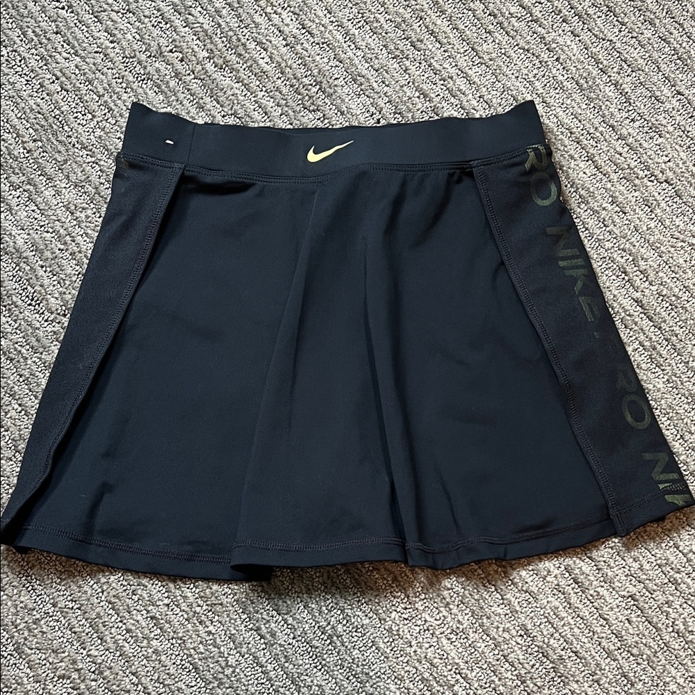 Black Nike Pro dry-fit skirt with yellow accent.